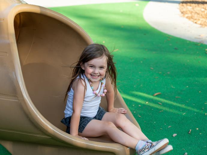 a girl sitting in a hammock